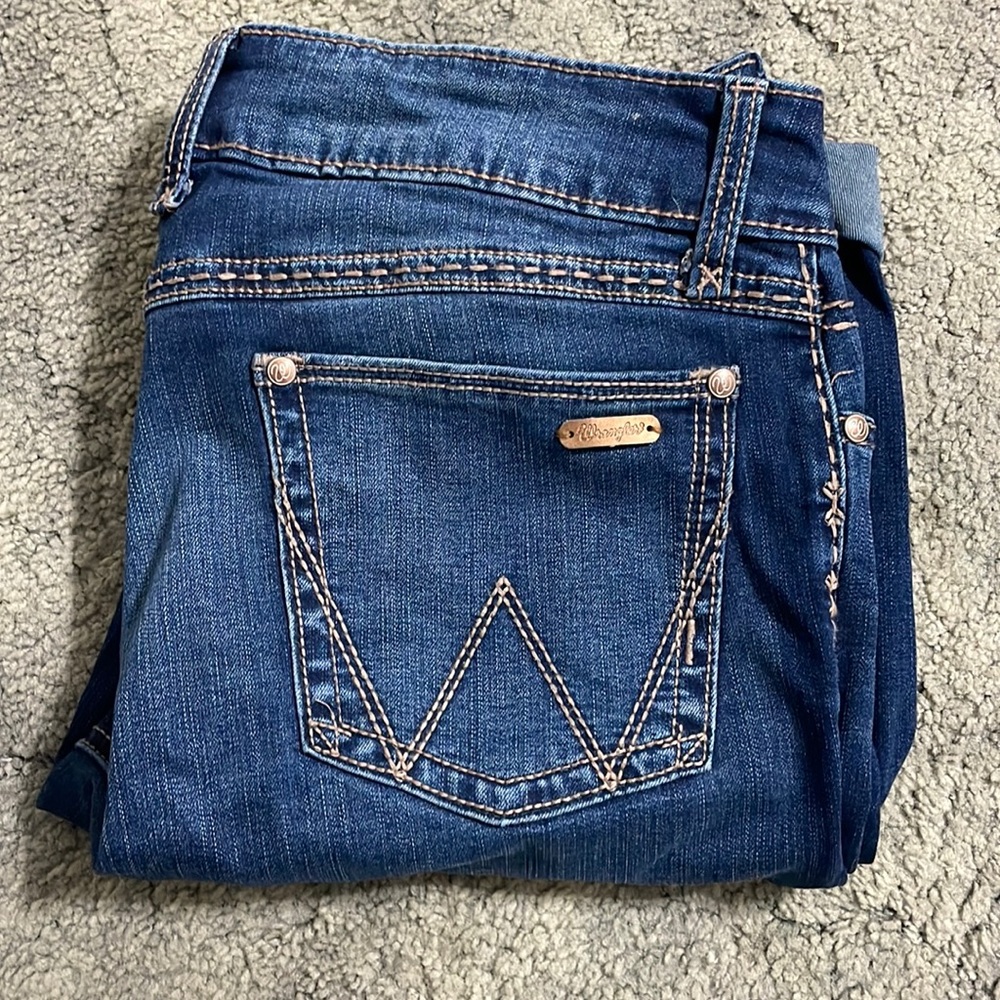 Wrangler jeans! Size 11/12 in the waist and 34 in length! Slightly worn!